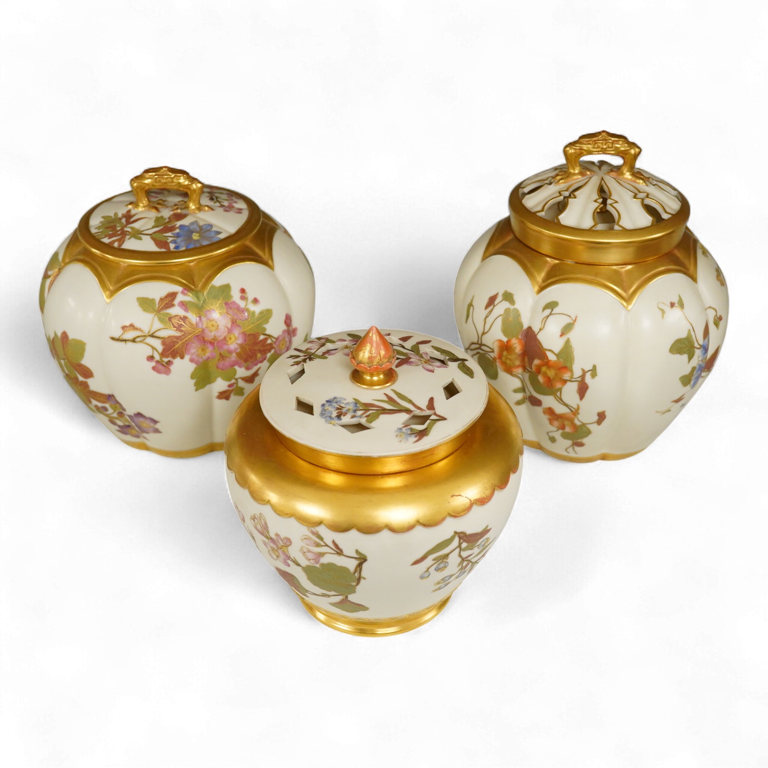 Three 19th century Worcester blush ivory potpourri or biscuit jars and covers, two with liners, each decorated with flowers and buds, largest 20cm high